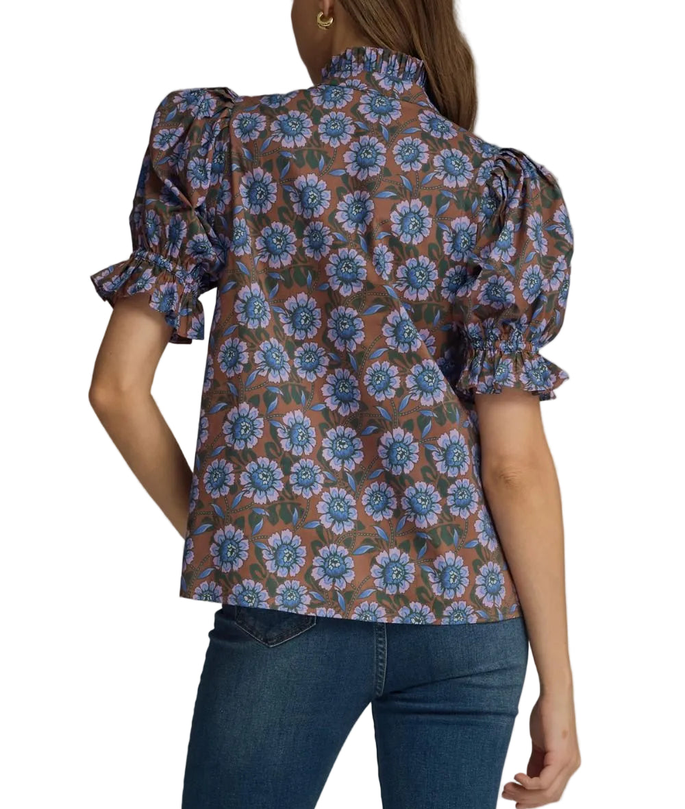 Floral elasticated short puff sleeve top featuring ruffled accent neck band collar V-neck. Elasticated ruffle sleeve hem. Unlined. Woven. Non-sheer. Lightweight.