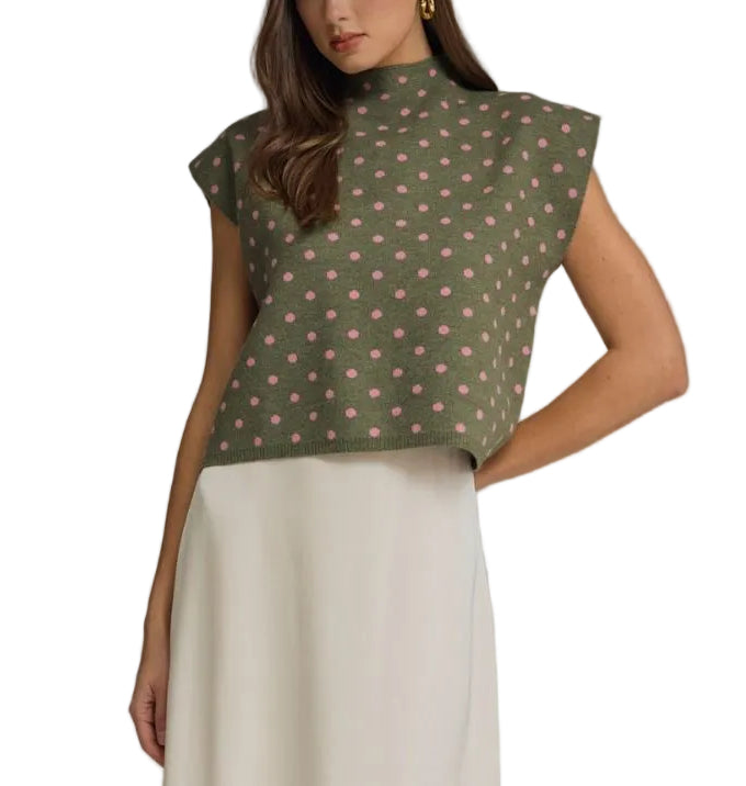 Polka dot mock neck sleeveless top featuring cap sleeve detail. Unlined. Woven. Non-sheer. Lightweight.