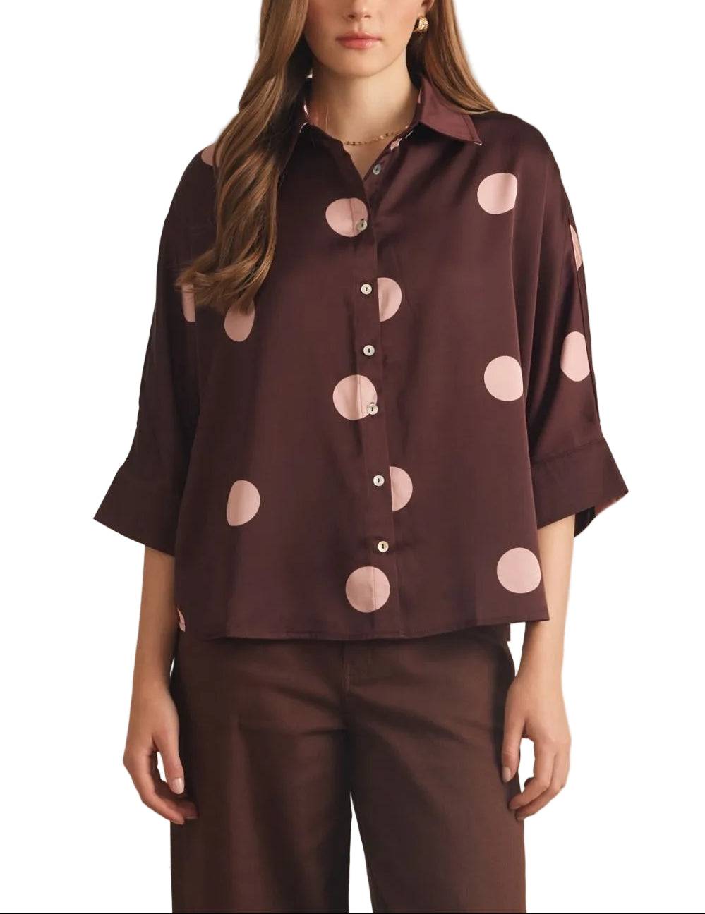 Polka dot collared 3/4 sleeve top featuring button closure at front. Button cuffs. Back pleat detail. Unlined. Woven. Non-sheer. Lightweight.