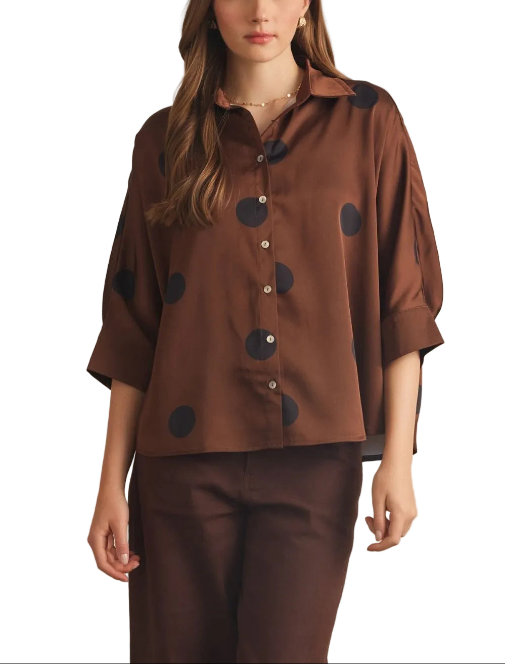 Polka dot collared 3/4 sleeve top featuring button closure at front. Button cuffs. Back pleat detail. Unlined. Woven. Non-sheer. Lightweight.