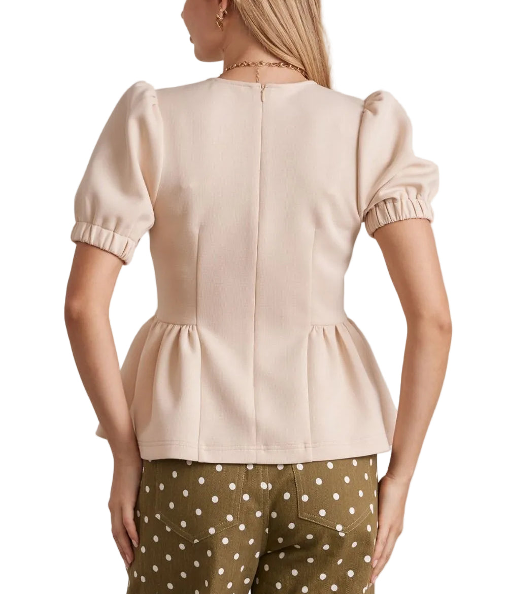 The Brielle Short Sleeve Top features a flattering peplum hem that adds dimension and movement to your everyday wardrobe. Crafted for comfort, this versatile piece pairs effortlessly with jeans, skirts, or trousers. The short sleeves offer breathable wear for warm weather, while the structured peplum detail creates a polished silhouette. Perfect for casual outings or dressed-up occasions.