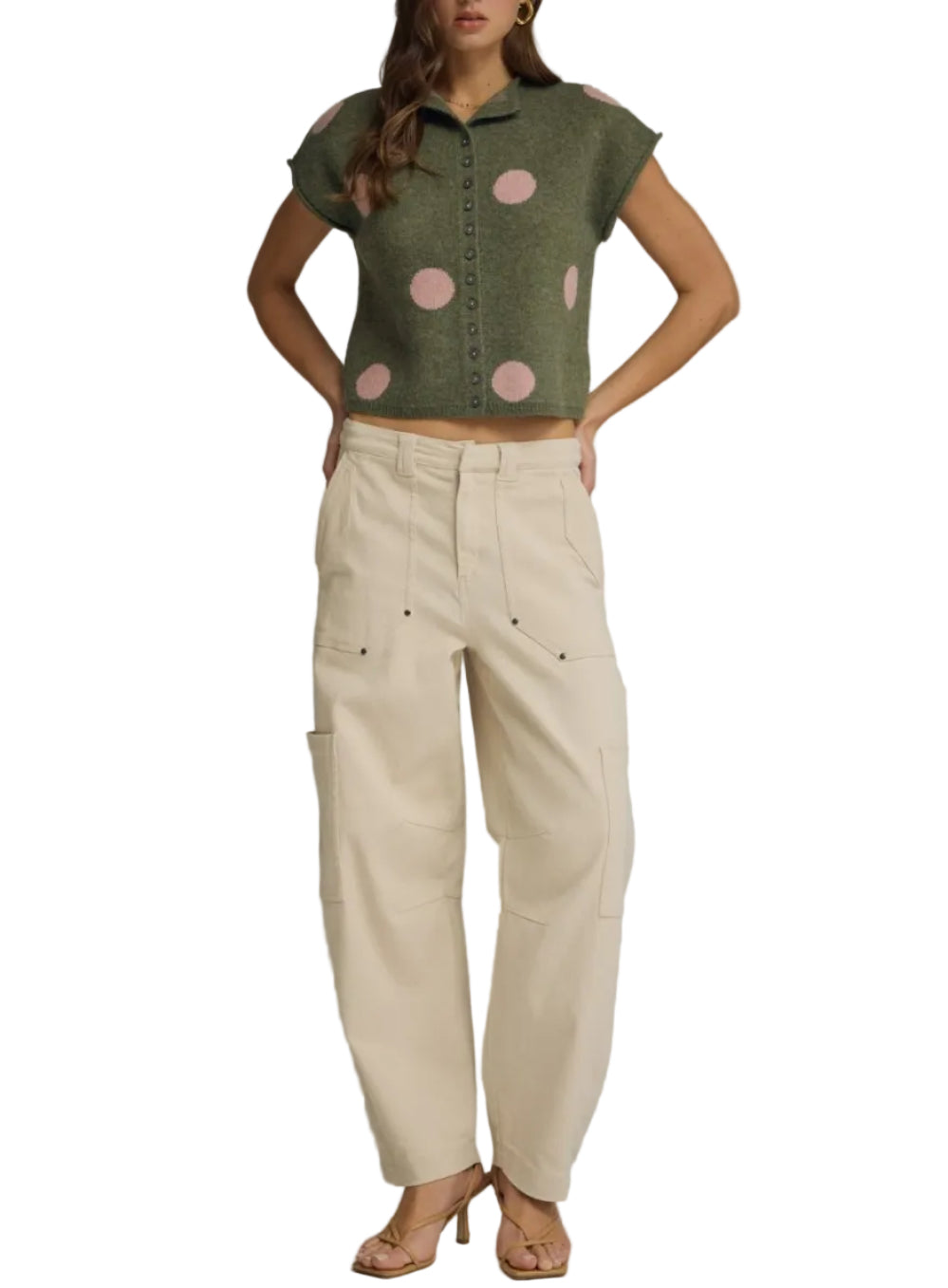 Polka dot collared short sleeve sweater knit top featuring button closure at front. Rolled sleeve openings. Unlined. Knit. Non-sheer. Lightweight.

