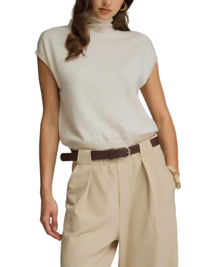 Solid mock neck cap sleeve knit top featuring scarf tie detail. Button closure at back neck. Unlined. Knit. Non-sheer. Lightweight.
