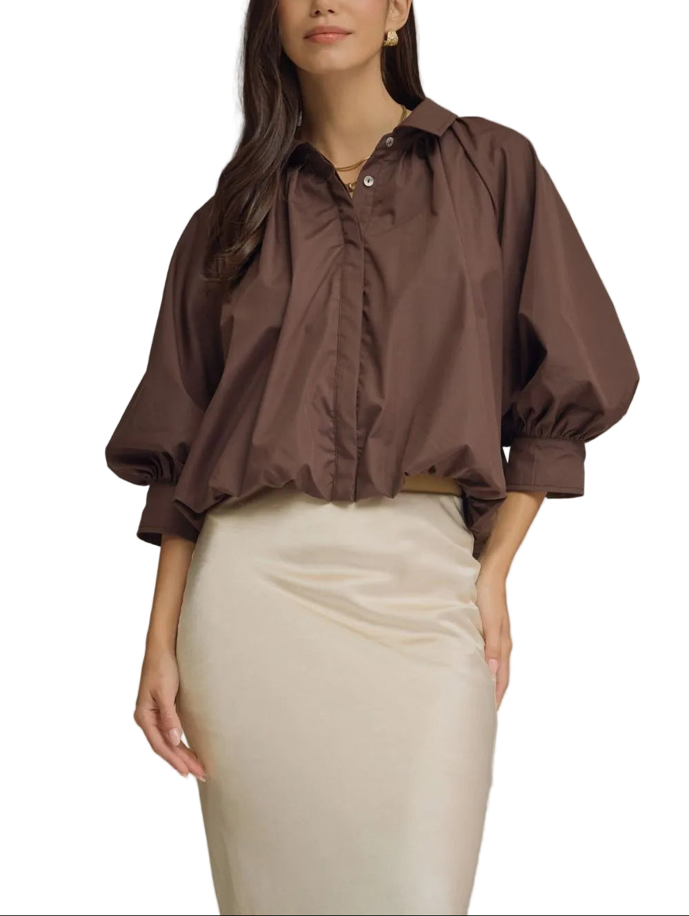Solid ¾ puff sleeve top featuring gathered detail at front and back yoke. Button closure at front. Button at cuff. Elasticated hem. Lined. Woven. Non-sheer. Lightweight.