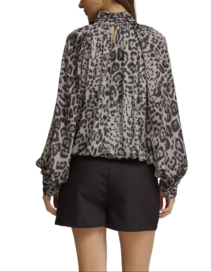 Elevate your wardrobe with the Sienna Leopard Print Balloon Sleeve Top, a bold statement piece that combines timeless animal print with contemporary silhouette. The dramatic balloon sleeves add volume and movement, creating an eye-catching look perfect for both casual outings and elevated occasions. Crafted for comfort and style, this top pairs effortlessly with jeans, skirts, or tailored trousers. 