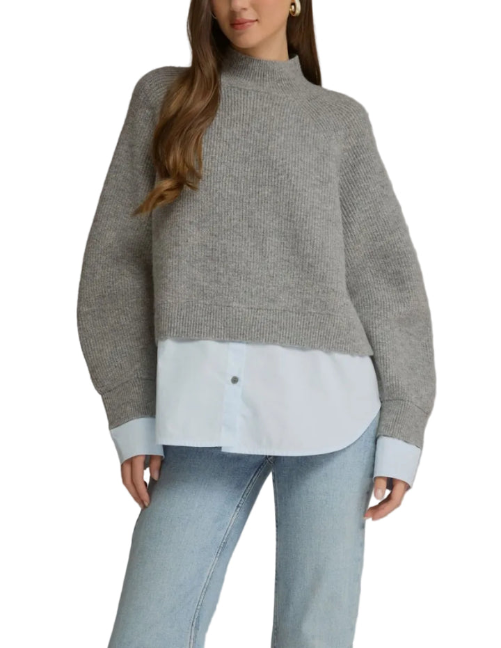 Solid long sleeve sweater top with a mock neck and layered shirt detail. Ribbed cuffs and hem. Unlined. Knit. Non-sheer. Medium weight.
