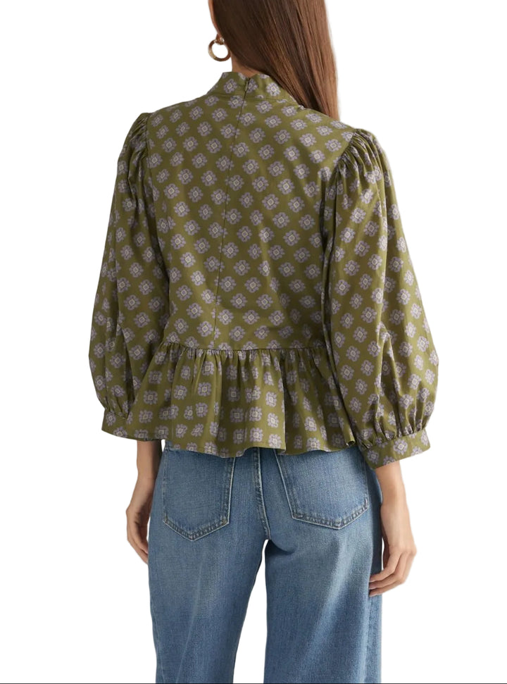 Floral ¾ balloon sleeve top with a stand collar and decorative frog button detail at front. Back zipper. Peplum hem. Lined. Woven. Non-sheer. Lightweight.