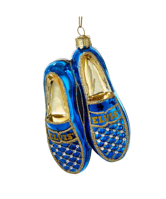 This Kurt Adler Elvis® blue suede shoes glass ornament is the perfect way for any Elvis® fan to have a "blue" Christmas! The glittering ornament resembles a pair of blue suede shoes with Elvis'® name printed on each shoe and is carefully detailed in a quilted rhinestone design. 