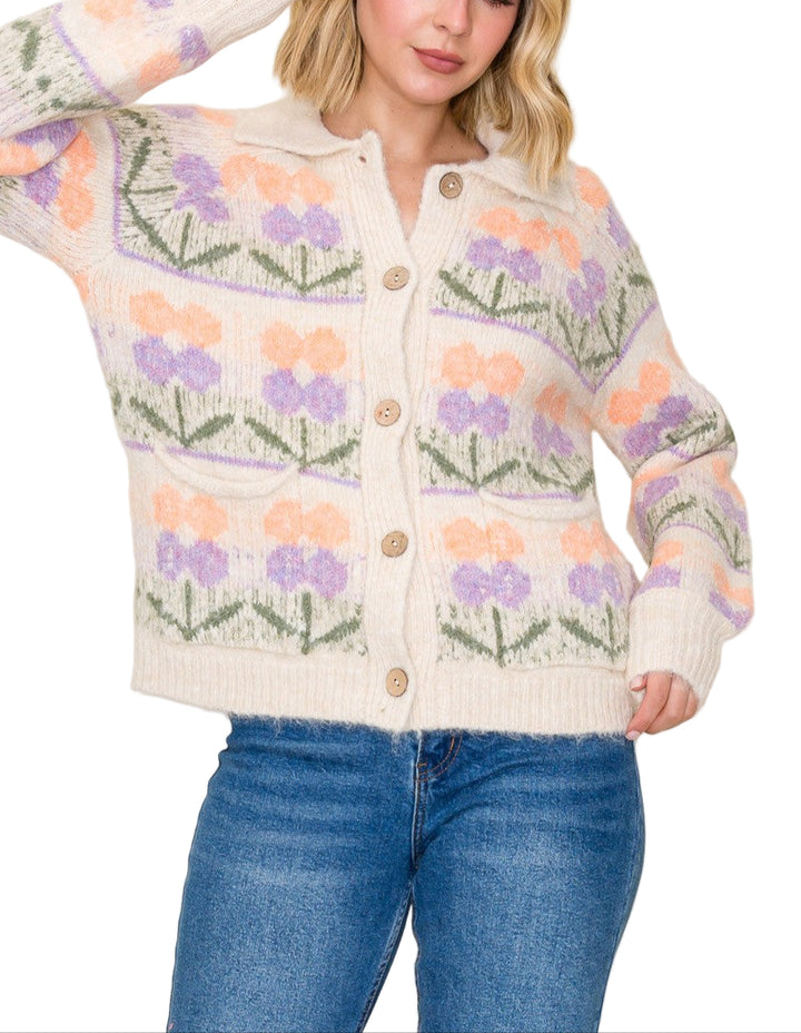Add a burst of cheerful charm to your wardrobe with the Lauren Flower Cardigan. This playful sweater features a chunky flower jacquard pattern and a cozy collared neckline, blending comfort with fun flair. Perfect for brightening up cool days while keeping you snug and stylish.