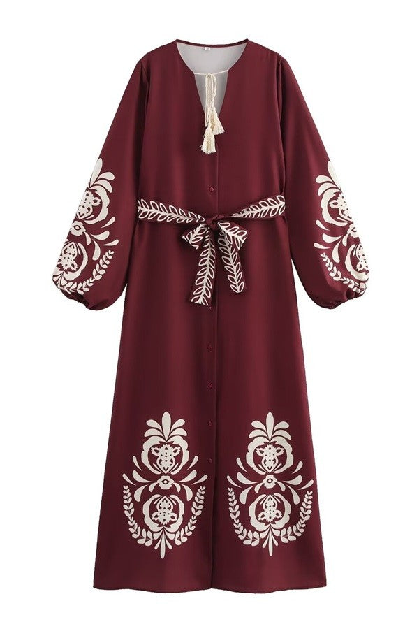 Step out in style with the Mia Long Dress in Burgundy. This playful piece features a flattering V-neck and long sleeves, perfect for any season. The button-down front adds a charming touch, making it easy to dress up or down.