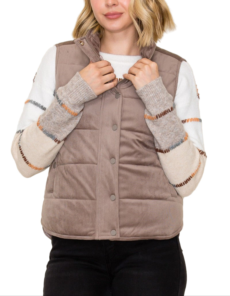 Stay cozy and cute in the Blaire Corduroy Puffer Vest! This mini puffer features a soft corduroy finish, easy snap placket, and handy side pockets perfect for stashing your essentials. Lightweight yet warm, it’s a playful layering piece that adds a dash of fun texture to any outfit.
