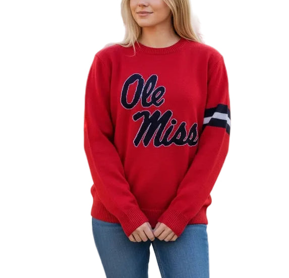Rep the Rebels in style in our RED Ole Miss sweater. A must have for any Hotty Toddy fan. Featuring the classic OLE MISS logo on the front and HOTTY TODDY on the back in the stripe break. Perfect for Grove tailgates, game days or just showing your Rebels spirit every day! Available on our site. Proud to be officially licensed. 
