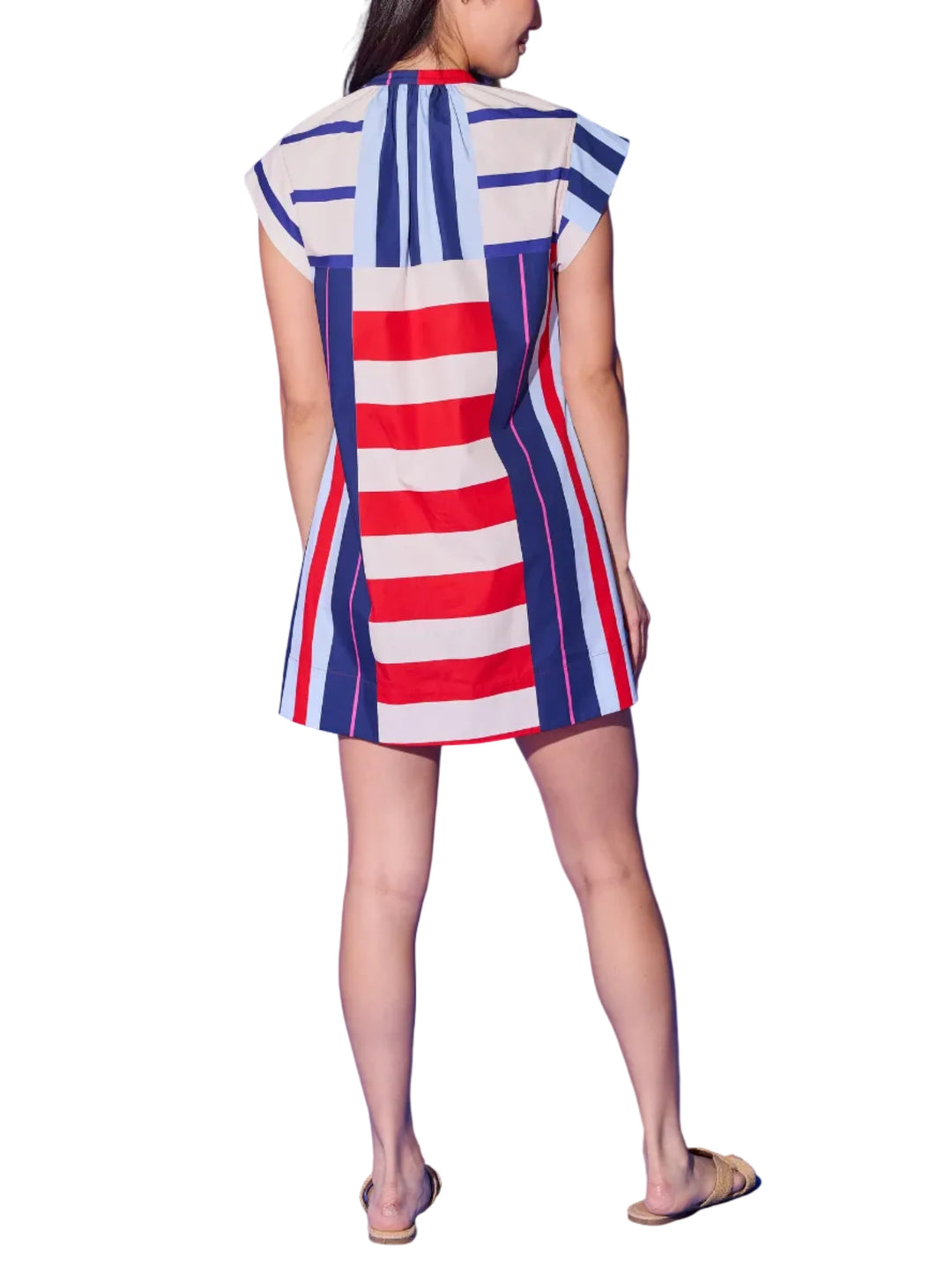 A bold mix-and-match stripe moment, the Tucker Dress is anything but ordinary. A playful clash of horizontal red-and-cream stripes and vertical navy-and-pink stripes come together in a striking color-blocked design that&