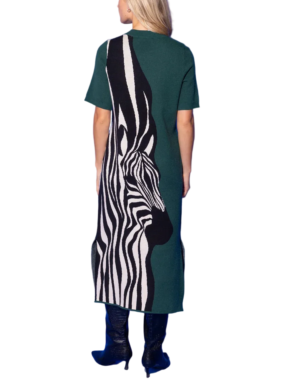 The Scout Dress in Wild Silhouette is a striking fusion of bold and refined. A dramatic oversized zebra motif in graphic black and cream sweeps across one side of this sleek knit midi, while a rich forest green grounds the other side in a chic, unexpected color-block contrast that&