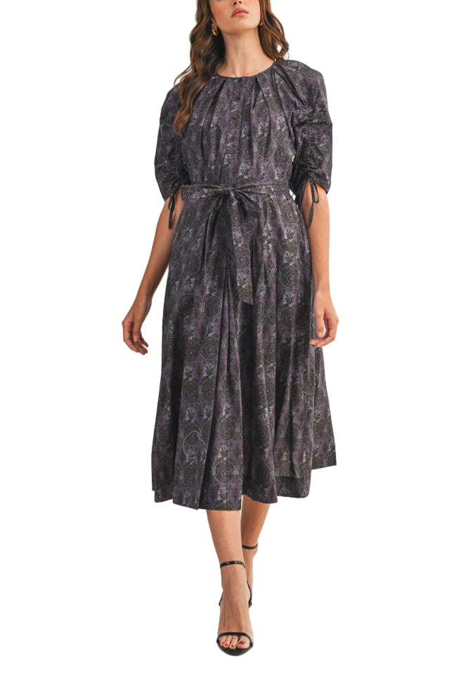 A romantic date calls for this floral button down belted midi dress! Floral print adorns woven fabric as it shapes this darling dress. A pleated round neckline with button placket is framed by short puff sleeves with drawstring detail. Pleated A-line skirt is cinched at the waist with a self tying belt before ending at a chic midi hem.
