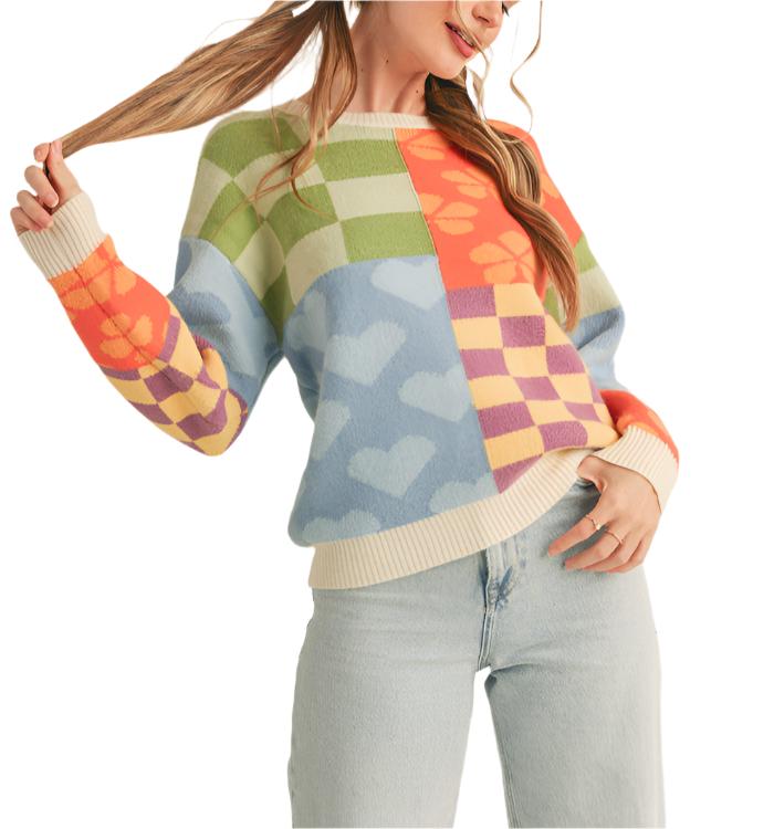 This multi-pattern patch sweater is the trendy upgrade your collection needs! Cozy knit shapes this flattering and playful sweater that has a round neckline and drop shoulder long sleeves. Patchwork of knit patterns add whimsy and charm to this oh-so-comfy sweater!