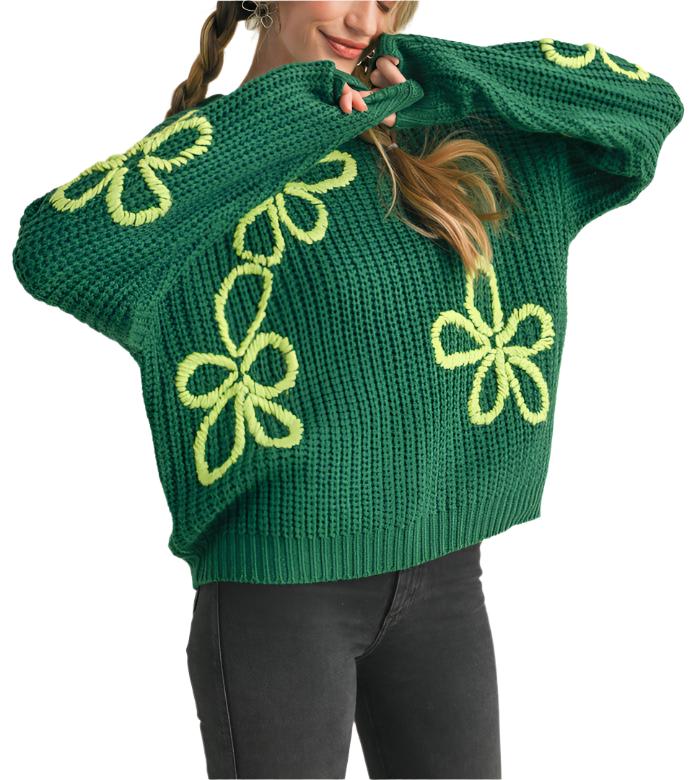 Soft and cozy knit shapes this playful sweater that has a ribbed crew neckline and drop shoulder long sleeves. Hand stitched floral knit adds charm to this oh-so-comfy sweater!