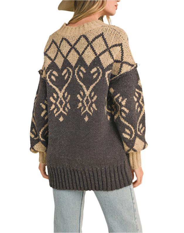 Cozy sweater knit shapes this essential pullover that has a ribbed crew neckline and roomy long sleeves with drop shoulders. The relaxed, oversized bodice features jacquard knit design and ends at a relaxed, waist-length fit.