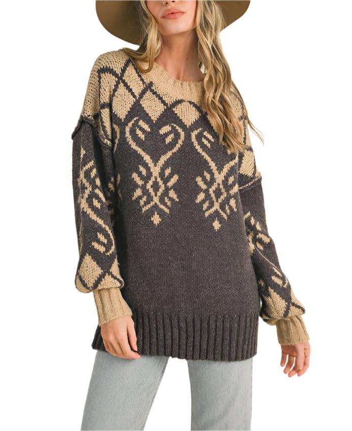 Cozy sweater knit shapes this essential pullover that has a ribbed crew neckline and roomy long sleeves with drop shoulders. The relaxed, oversized bodice features jacquard knit design and ends at a relaxed, waist-length fit.