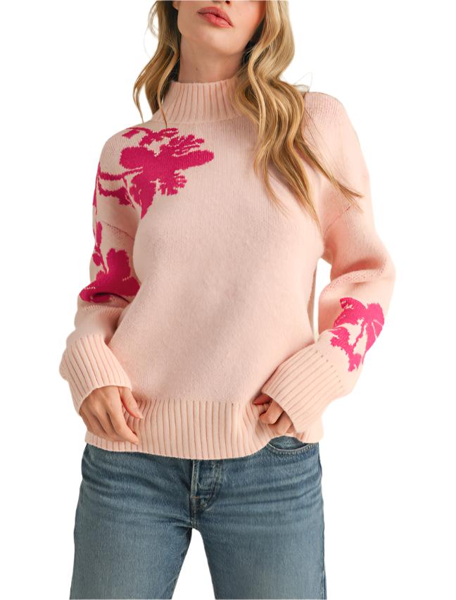 Warm sweater knit shapes this pullover that has cute floral knit detail on the shoulders and sleeves, a mock neckline, long sleeves, and a relaxed bodice.