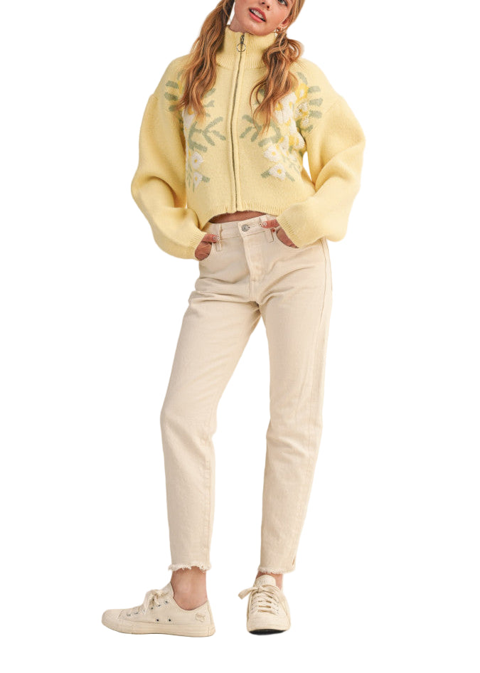 Your outfits will always be casually cute when you've got this zip-up sweater cardigan! Soft and cozy knit shapes long puff sleeves that frame a bodice with a ribbed stand collar, a zip-up closure, and semi-cropped relaxed bodice. Stunning floral knit design gives this cardigan the extra "oomph" your closet needs!