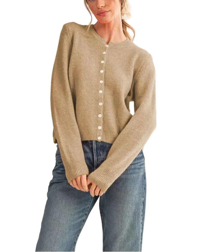 Elevate your everyday wardrobe with the Eliana Cardigan Sweater. This versatile layering piece features a classic button-front design and comfortable fit, perfect for transitioning between seasons. Crafted for both style and ease, it pairs effortlessly with jeans, dresses, or trousers. A timeless essential that works as hard as you do.