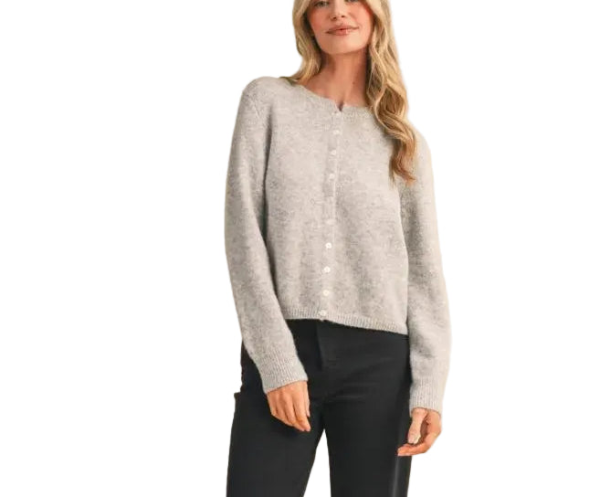 Elevate your everyday wardrobe with the Eliana Cardigan Sweater. This versatile layering piece features a classic button-front design and comfortable fit, perfect for transitioning between seasons. Crafted for both style and ease, it pairs effortlessly with jeans, dresses, or trousers. A timeless essential that works as hard as you do.