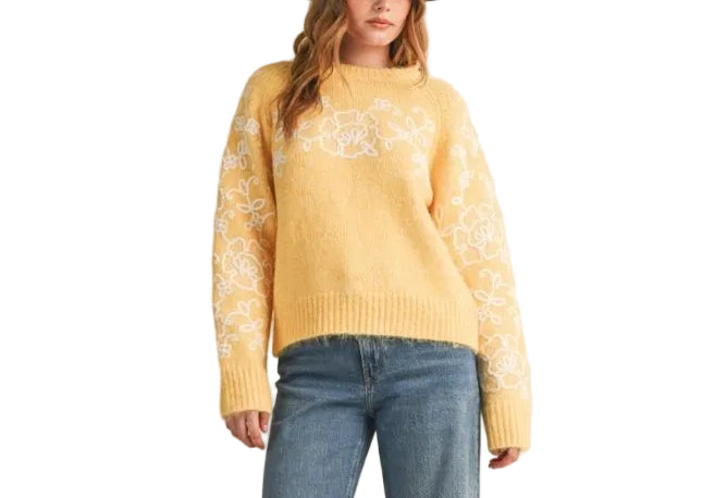 With an eye-catching delicate floral embroidery in contrast knit color, this sweater will do all the work of styling for you! Cozy sweater knit shapes a relaxed fit bodice with a round neckline and raglan seam long sleeves. Ribbed knit accents the neckline, cuffs, and hem.