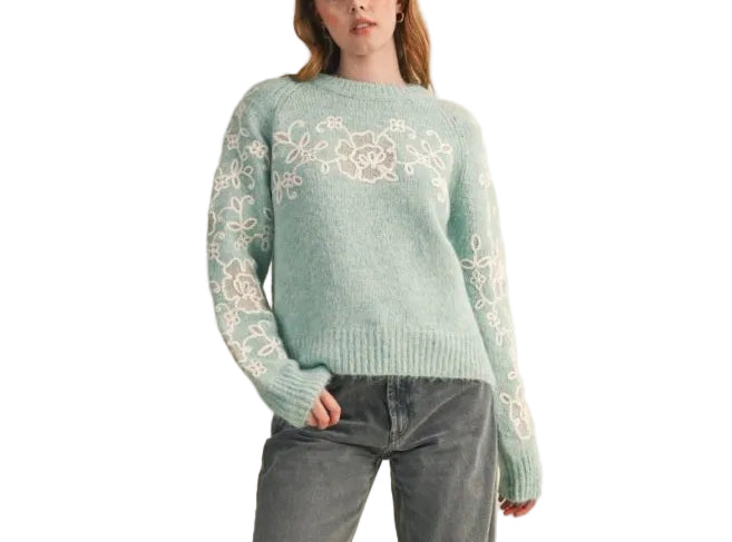 With an eye-catching delicate floral embroidery in contrast knit color, this sweater will do all the work of styling for you! Cozy sweater knit shapes a relaxed fit bodice with a round neckline and raglan seam long sleeves. Ribbed knit accents the neckline, cuffs, and hem.