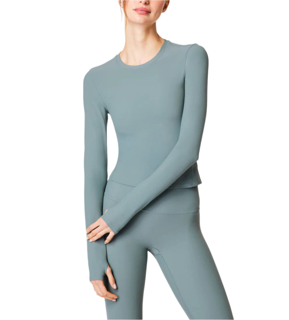 Our SPANXsmooth™ OnForm Long Sleeve Top is made from buttery-soft, lightweight performance fabric with gentle smoothing built in. Breathable, sweat-wicking, and crafted with 4-way stretch, this long sleeve shirt features convenient thumbholes for a secure fit (and added warmth). This versatile activewear style moves with you, and is perfect for before, during, and after your low-intensity workouts like pilates or yoga.