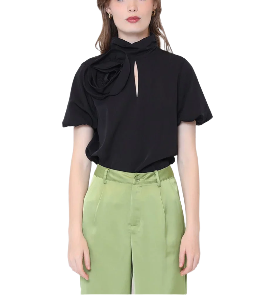 Add a touch of whimsy to your wardrobe with this Rose Detail Puff Sleeve Top. Featuring charming puff sleeves and delicate rose accents, it’s perfect for brightening up any day with a playful feminine flair.