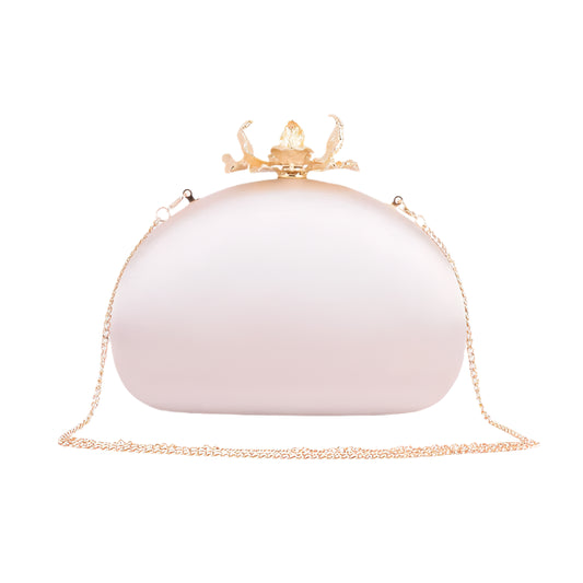 Embrace the epitome of elegance with the Elodie Silk Round Clutch, adorned with intricate flower hardware and a chic chain crossbody strap. This sophisticated accessory captures the essence of refined femininity, as the smooth silk exudes luxury and the detailed floral hardware adds a touch of romance. The versatile chain strap ensures effortless carrying, making it an ideal companion for any occasion. Elevate your style and make a statement with this beautifully crafted clutch, where the delicate allure of