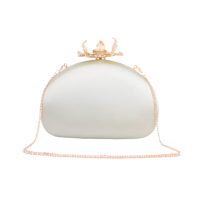 Embrace the epitome of elegance with the Elodie Silk Round Clutch, adorned with intricate flower hardware and a chic chain crossbody strap. This sophisticated accessory captures the essence of refined femininity, as the smooth silk exudes luxury and the detailed floral hardware adds a touch of romance. The versatile chain strap ensures effortless carrying, making it an ideal companion for any occasion. Elevate your style and make a statement with this beautifully crafted clutch, where the delicate allure of