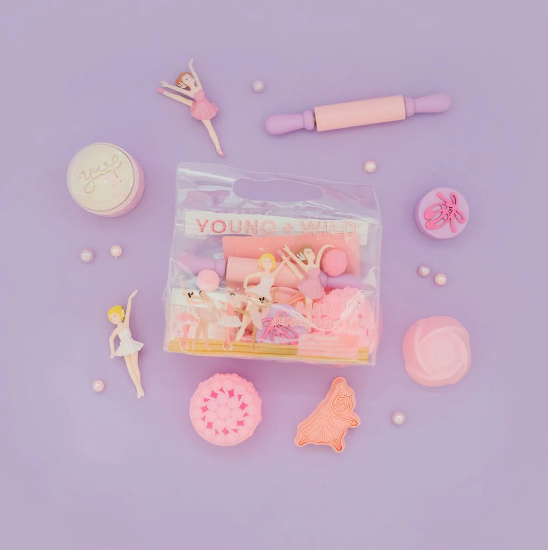 A pink and pastel toy set in a clear plastic bag labeled &