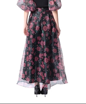 Float through your day with this sheer rose print long skirt in striking black and red. Its delicate fabric and vibrant floral design add a flirty touch to any outfit, perfect for twirling into the evening or brightening up a casual day.
