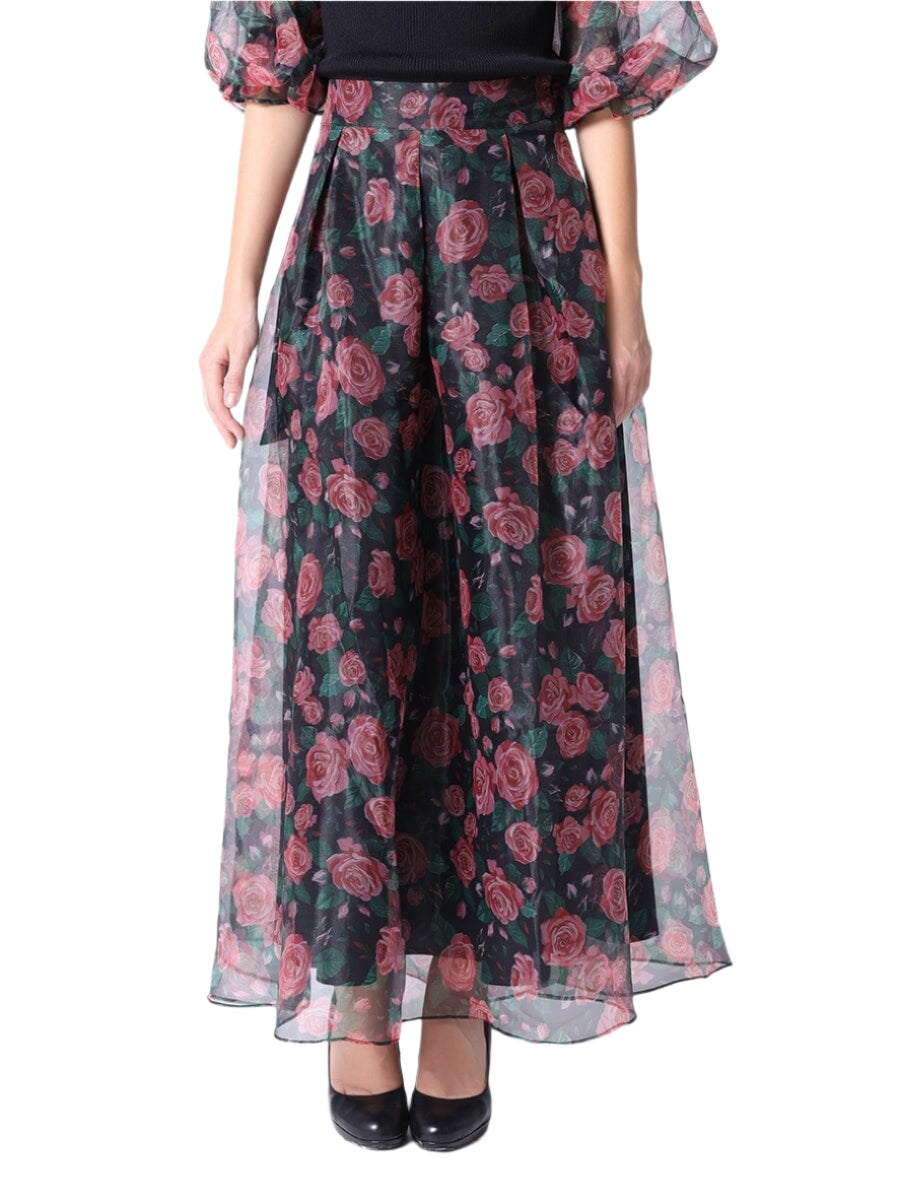 Float through your day with this sheer rose print long skirt in striking black and red. Its delicate fabric and vibrant floral design add a flirty touch to any outfit, perfect for twirling into the evening or brightening up a casual day.