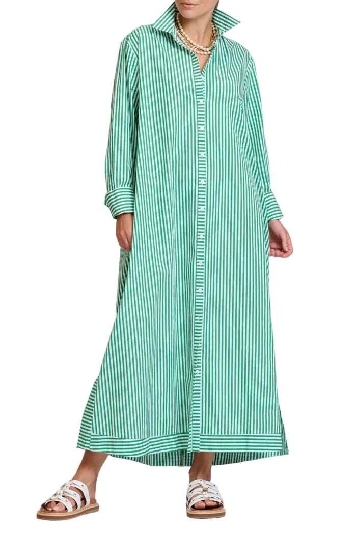 Woman wearing a green and white striped dress on a plain background