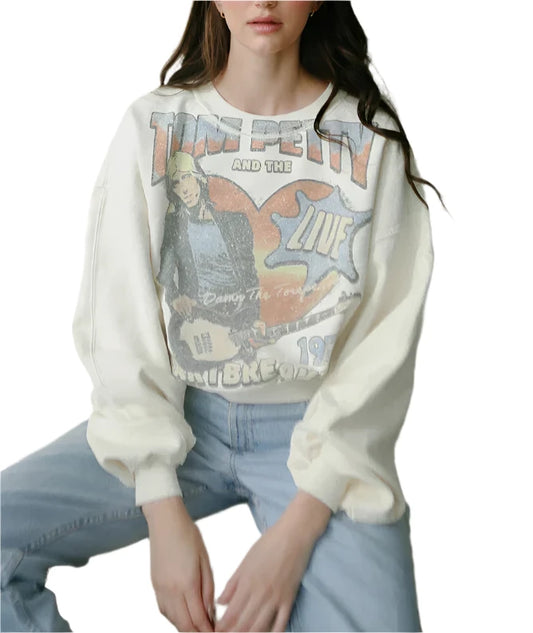 Our 'Tom Petty and the Heartbreakers 1979 Sweatshirt' marries classic rock vibes with a commitment to ethical fashion. Crafted from pure organic cotton, its soft vintage cream shade—courtesy of gentle, low-impact dyes—pays homage to an era of timeless tunes and forward-thinking environmental care. A must-have for anyone who loves their music with a side of eco-consciousness, this sweatshirt radiates a luxe yet responsible charm.