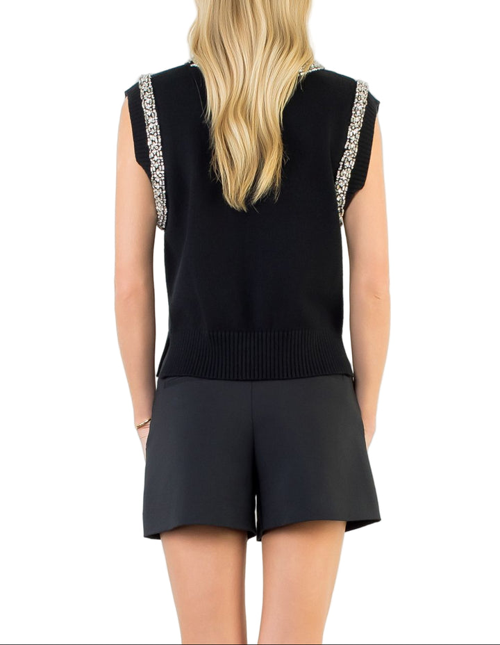The Willow Sleeveless Top is your new go-to for effortless style. This charming knit piece features delicate embellishments that add just the right amount of sparkle without stealing the show. Perfect for layering over your favorite tee or wearing solo on warmer days, it transitions seamlessly from casual brunch to evening plans.