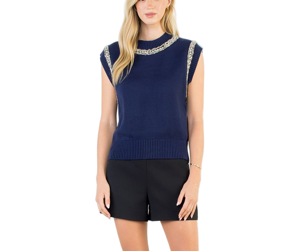 The Willow Sleeveless Top is your new go-to for effortless style. This charming knit piece features delicate embellishments that add just the right amount of sparkle without stealing the show. Perfect for layering over your favorite tee or wearing solo on warmer days, it transitions seamlessly from casual brunch to evening plans.